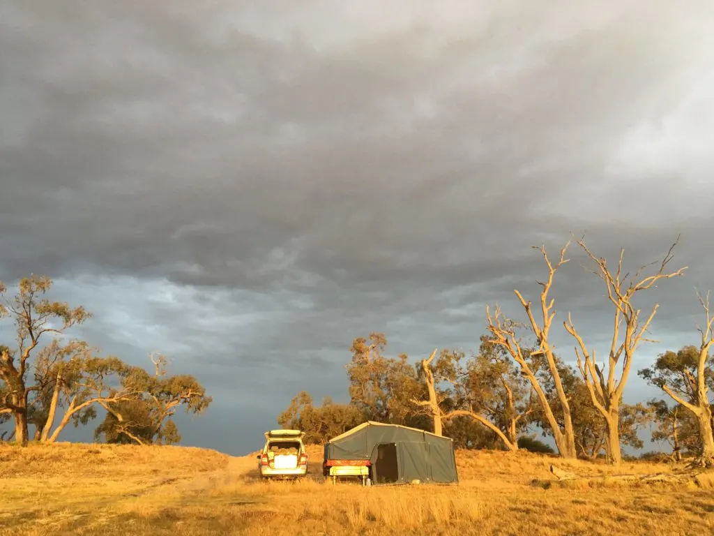 camp set up with dark sky in the background