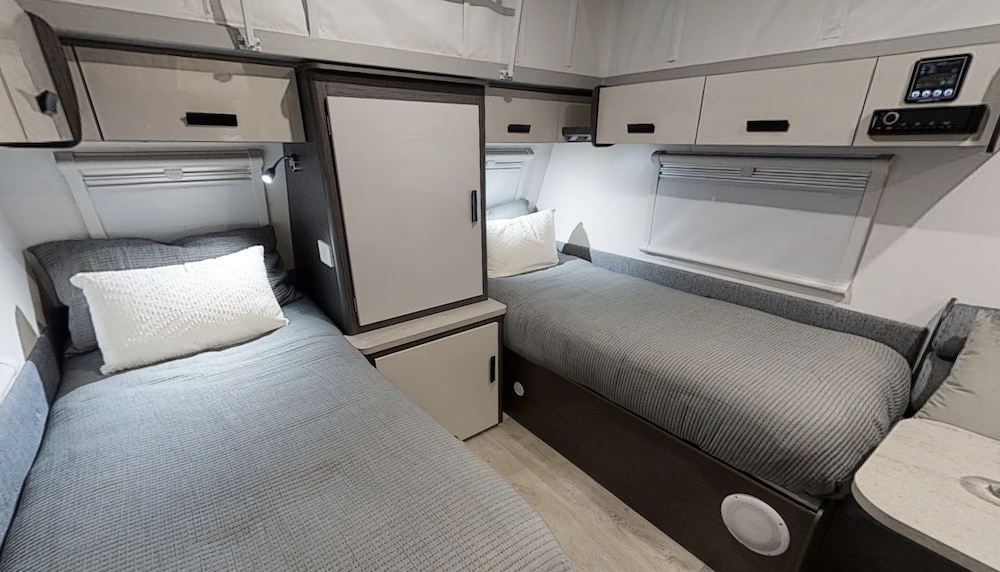 Two single beds inside a Jayco Journey pop top caravan.
