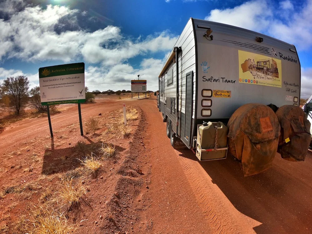 Rear view of a dusty caravan in the Australian outback