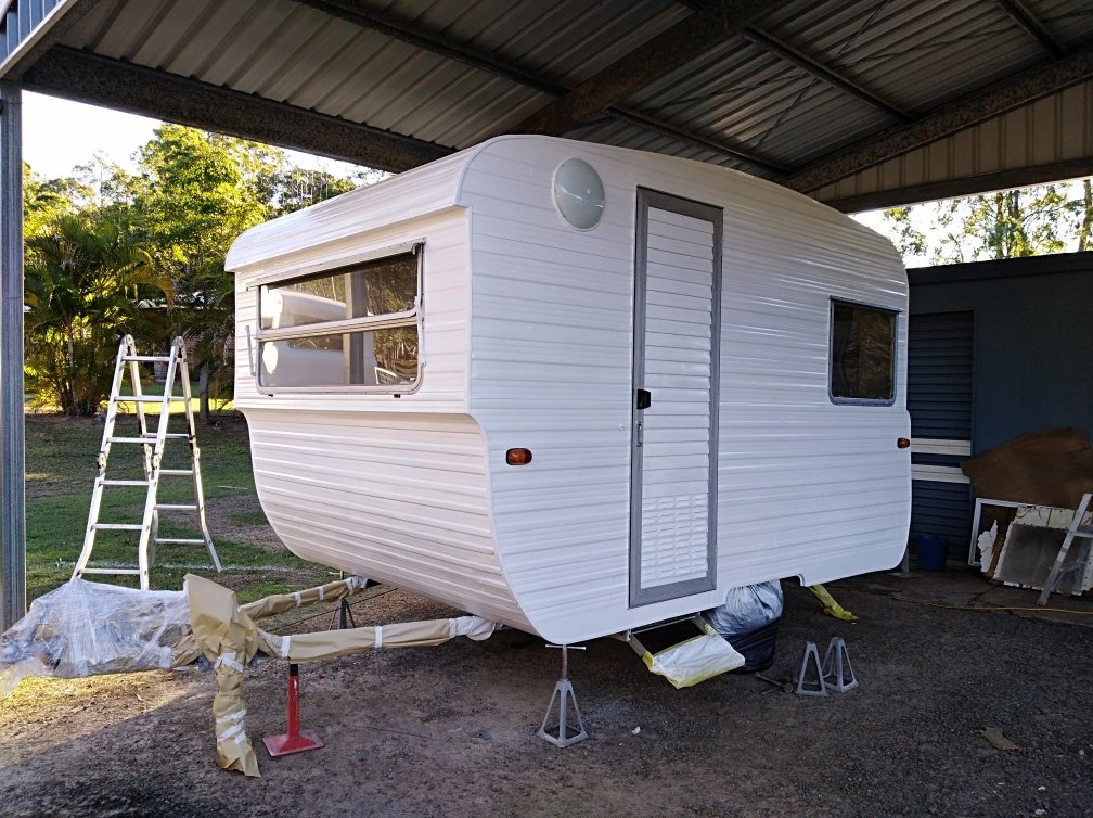 Small York caravan with freshly spray painted white exterior