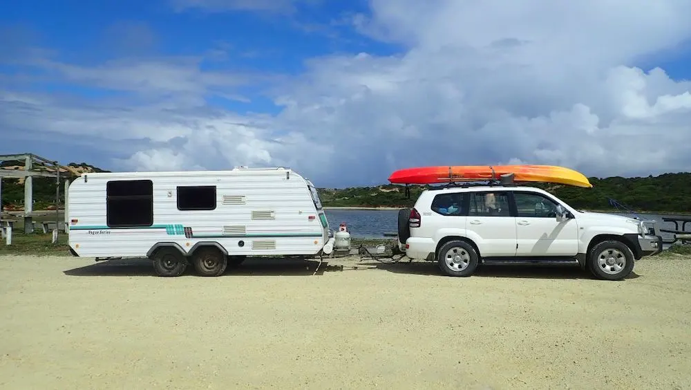 Car and caravan (with a kayak on the roof of the car) in Australia
