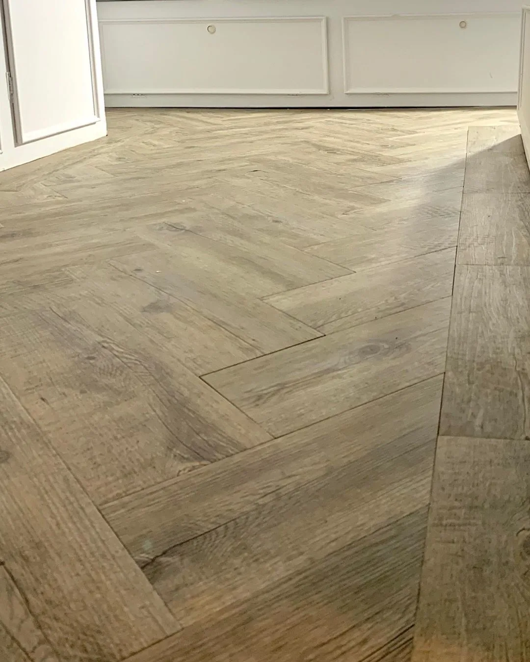 Herringbone pattern on the floor of renovated caravan