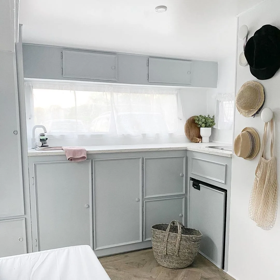 White and grey kitchen inside a vintage caravan (renovated)
