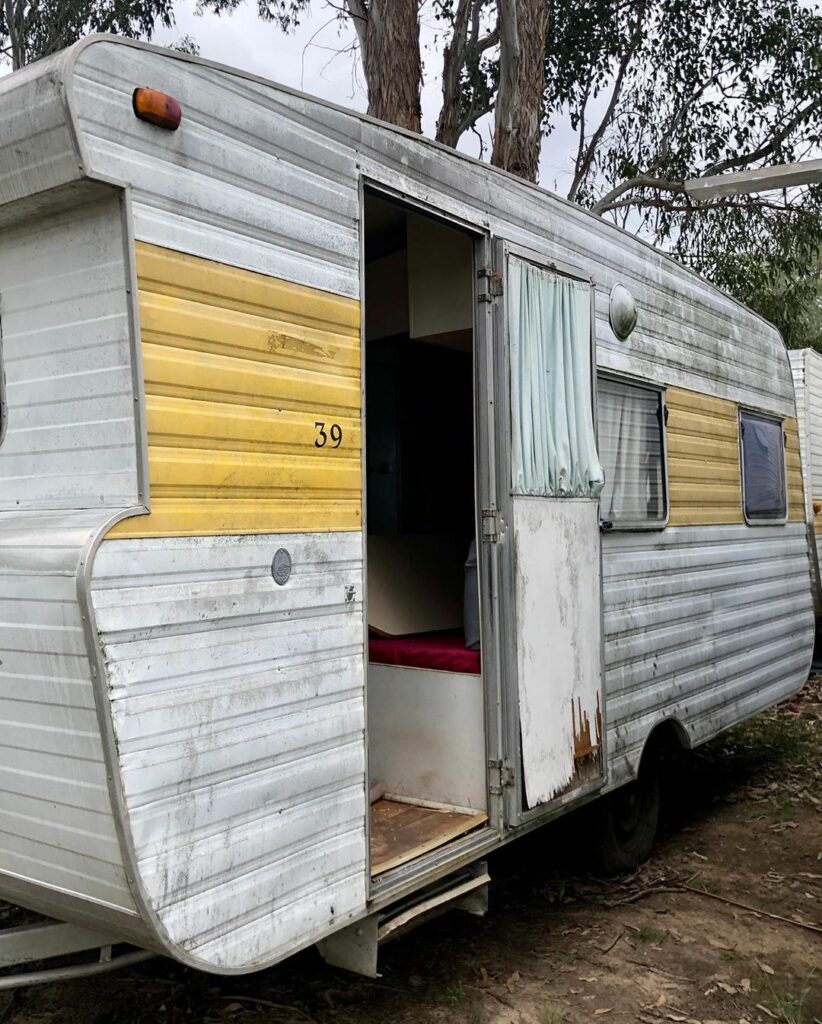 Exterior of an old and dirty caravan