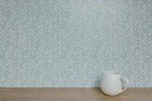 Teal coloured vinyl splashback sticker in a herringbone subway tile pattern