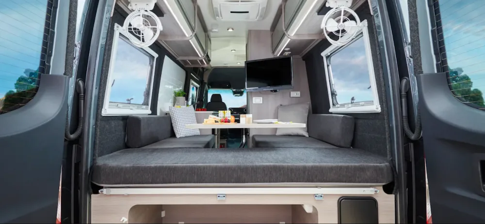 Interior view of the Jayco All Terrain Campervan looking in from the back doors.