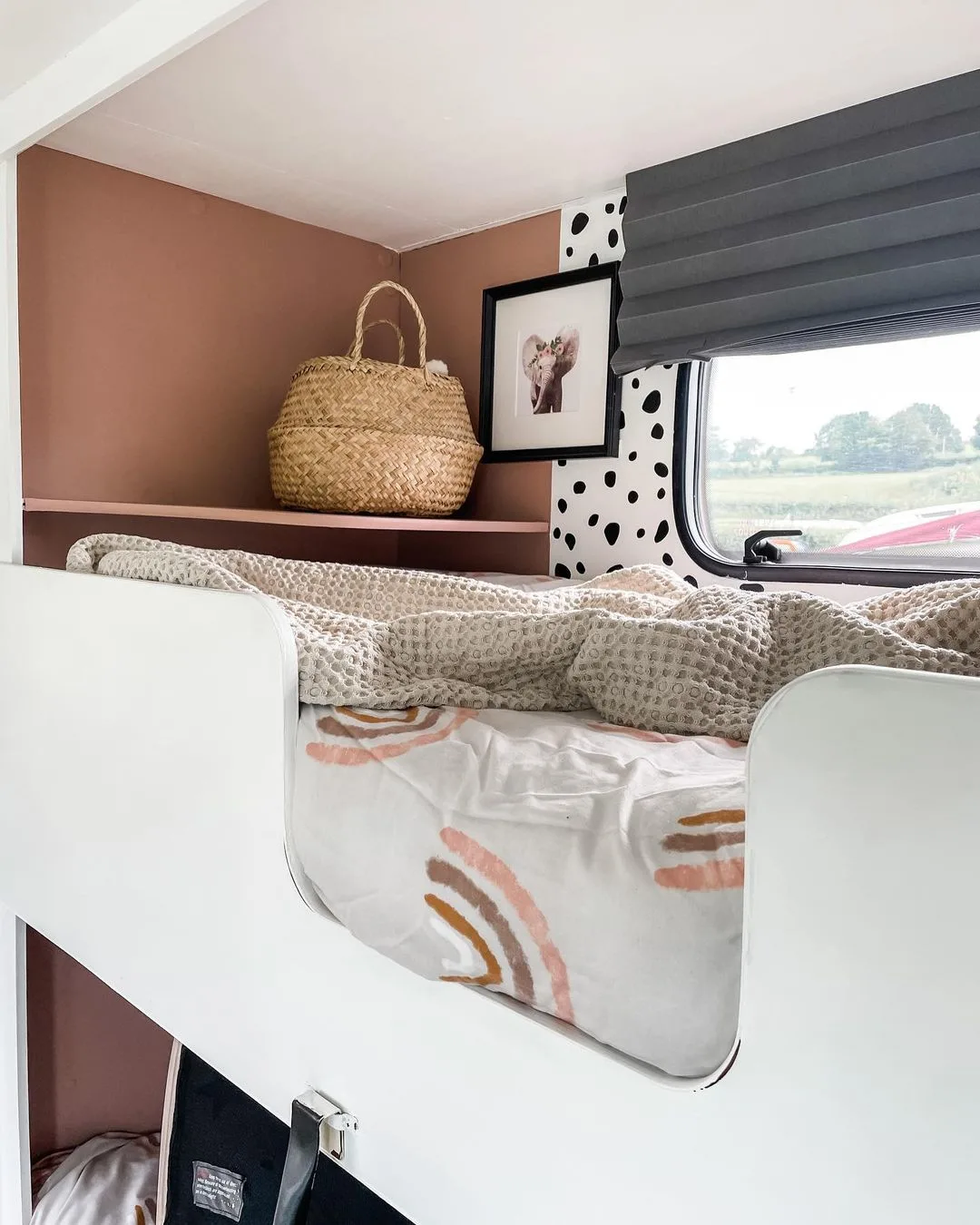 Double bunks inside a renovated caravan.