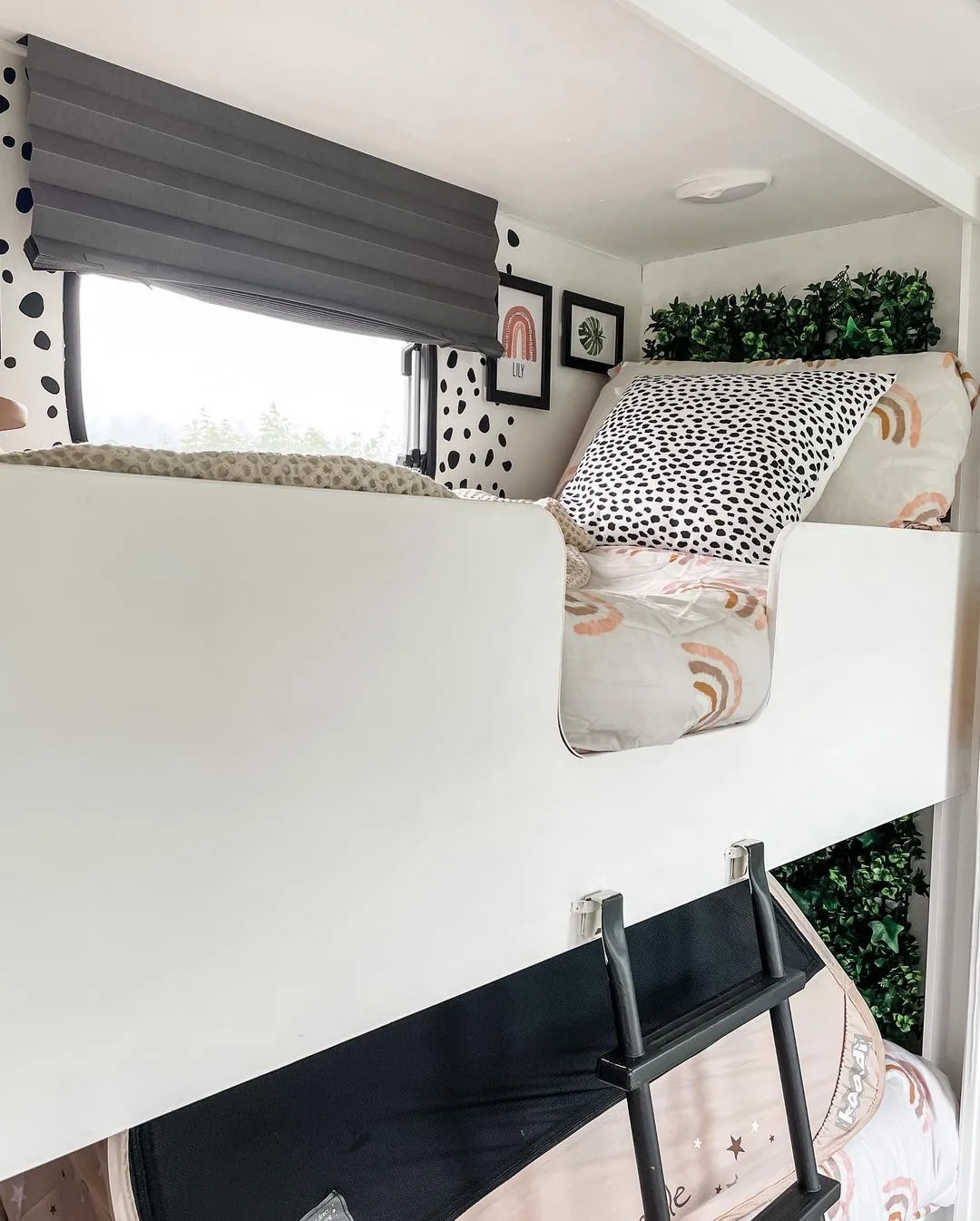 Double bunks inside a renovated caravan.