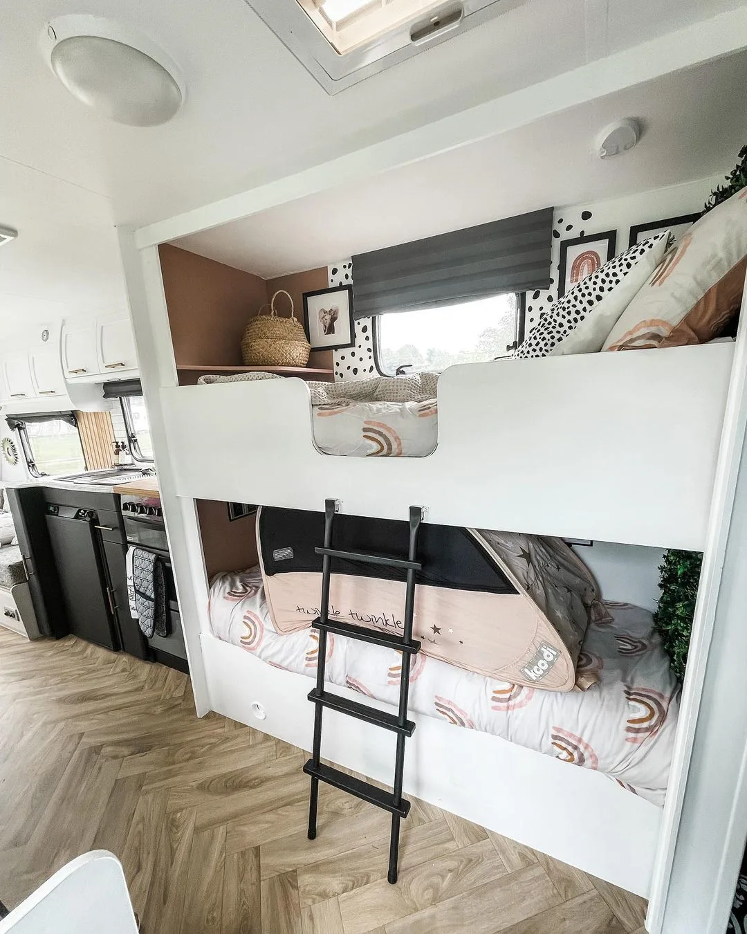 Double bunks inside a renovated caravan.