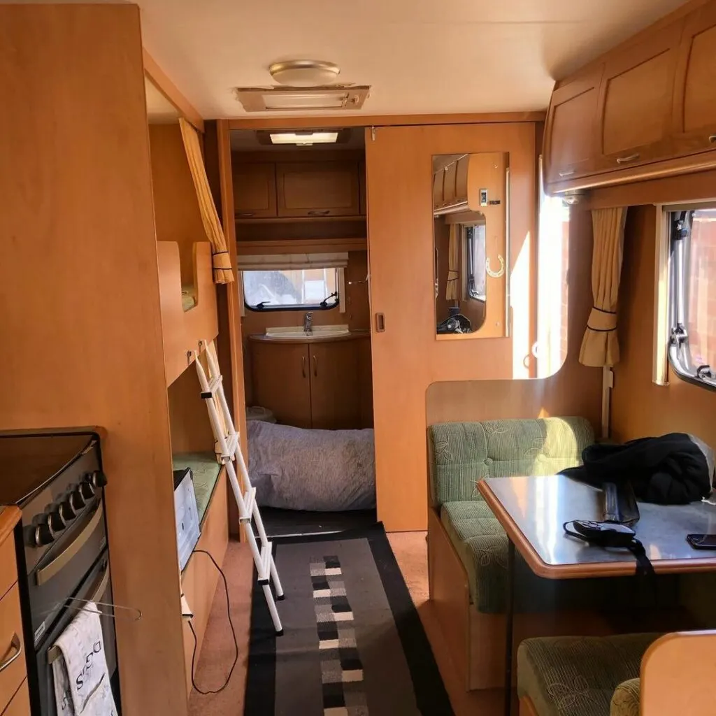 Brown interior of a caravan before renovation.