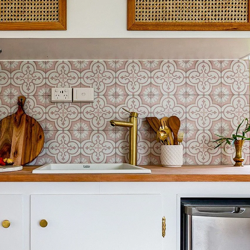 Small kitchen in a vintage caravan, with retro style backsplash.