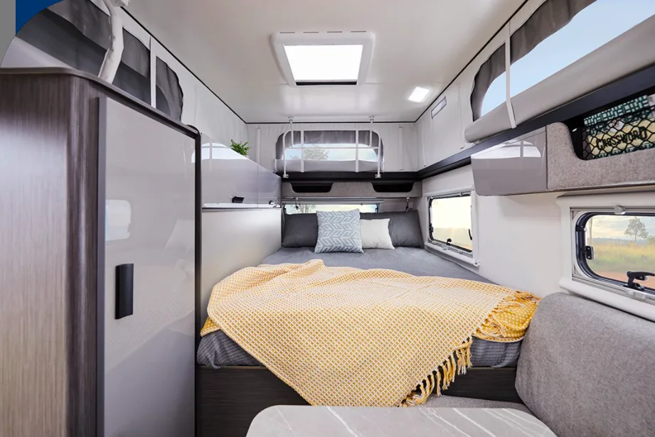 The bed area inside a Jayco Crosstrak hybrid caravan.