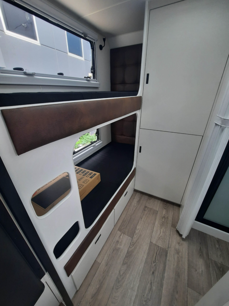 Double bunk beds inside the Coastline family vans by Australis Caravans.