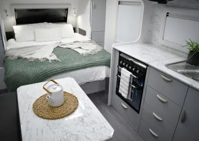 Interior view of the Crusader XCountry Trailbreaker off road caravan showing the island bed and dining area.