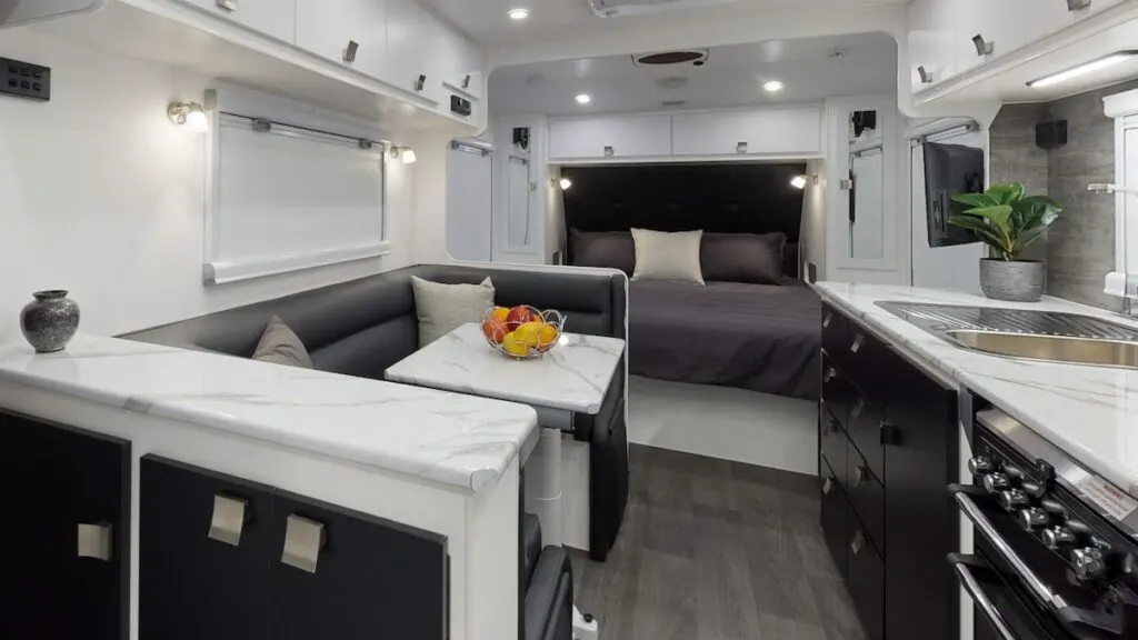 Interior view of the Provincial Liberty off road caravan showing the bedroom, dining and kitchen.